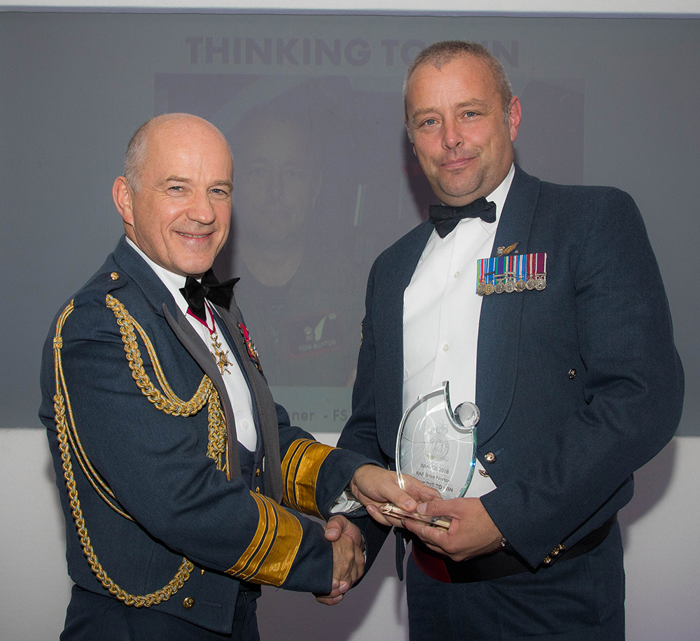Deputy Commander Operations, Air Marshal Stuart Atha CB DSO MA BSc RAF presents the Thinking to Win award to Flight Sergeant Thomas Buxton