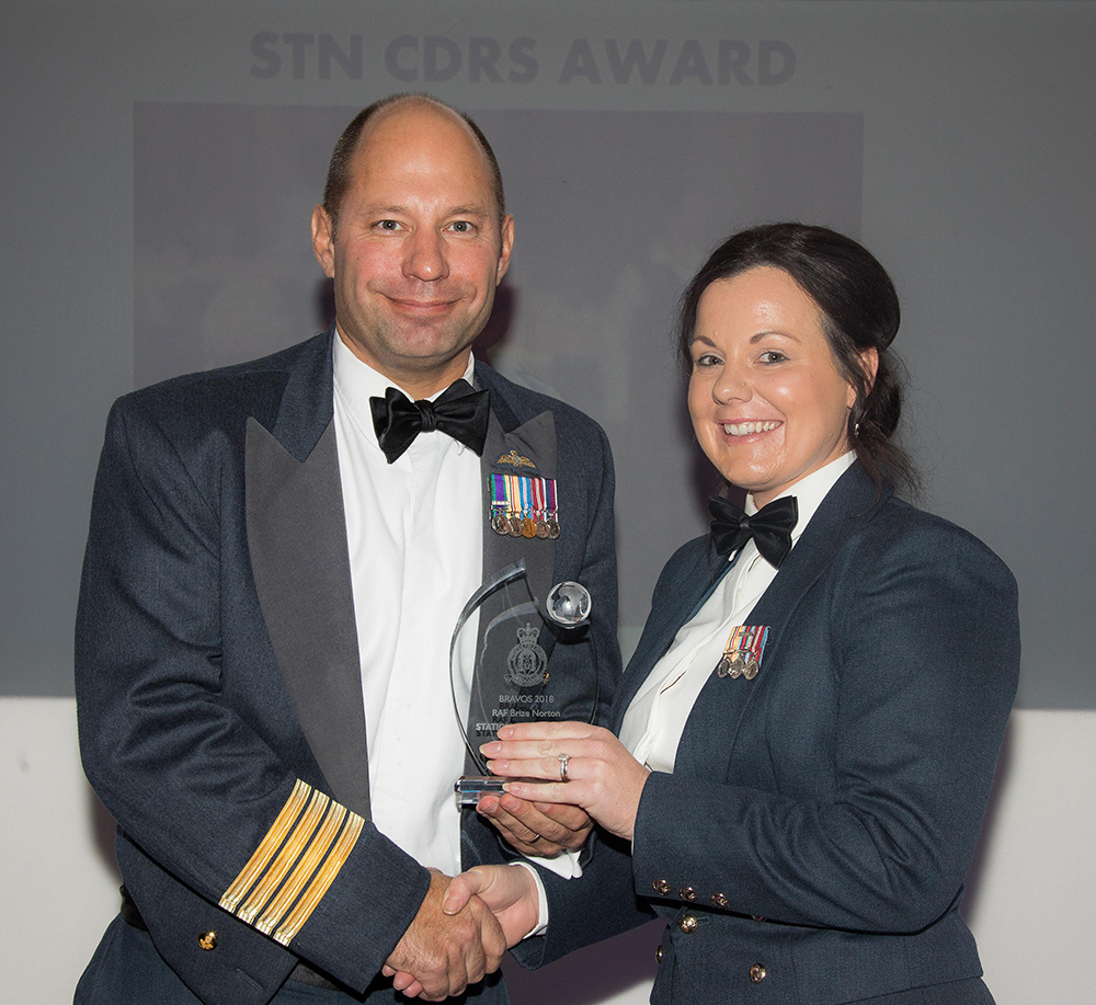Group Captain Dan James MA MEng RAF presenting his Station Commanders Award to Sergeant Nikita Lydon