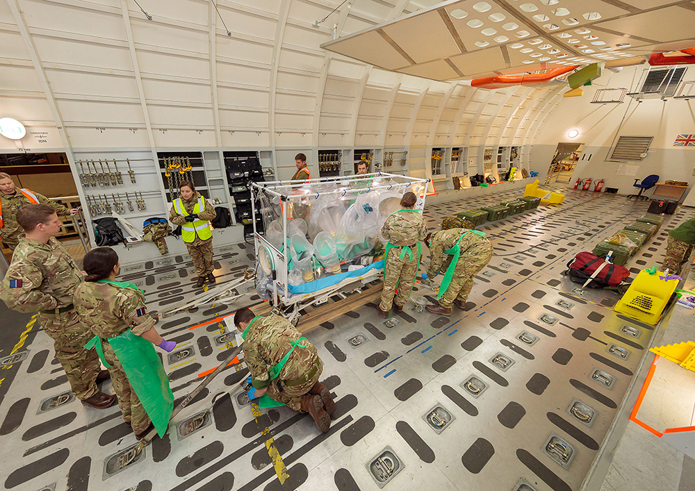 The ATI is loaded onto the C-17 Rear Crew Trainer, where the team then carry out the drills for looking after the patient during flight