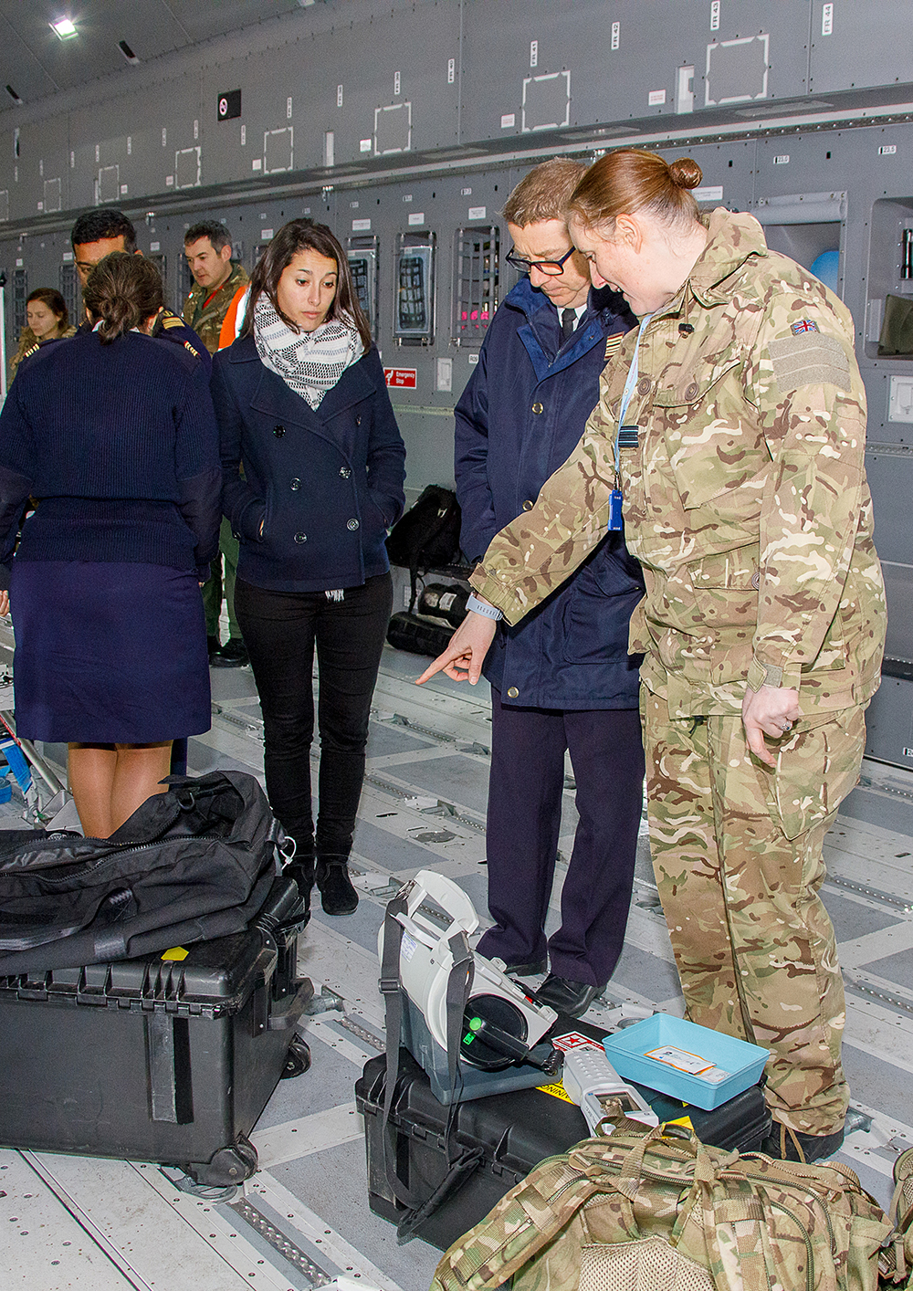 Members of TMW talk through the medical kit and equipment that is required for AE