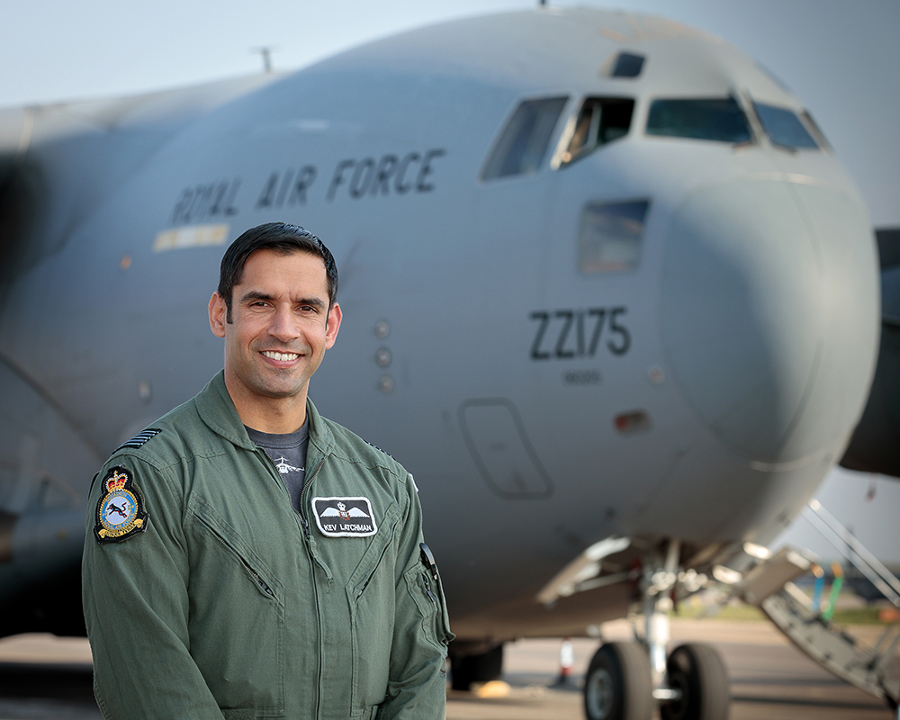 Wing Commander Latchman, Officer Commanding No. 99 Squadron, standing in front of a C-17 Globemaster aircraft
