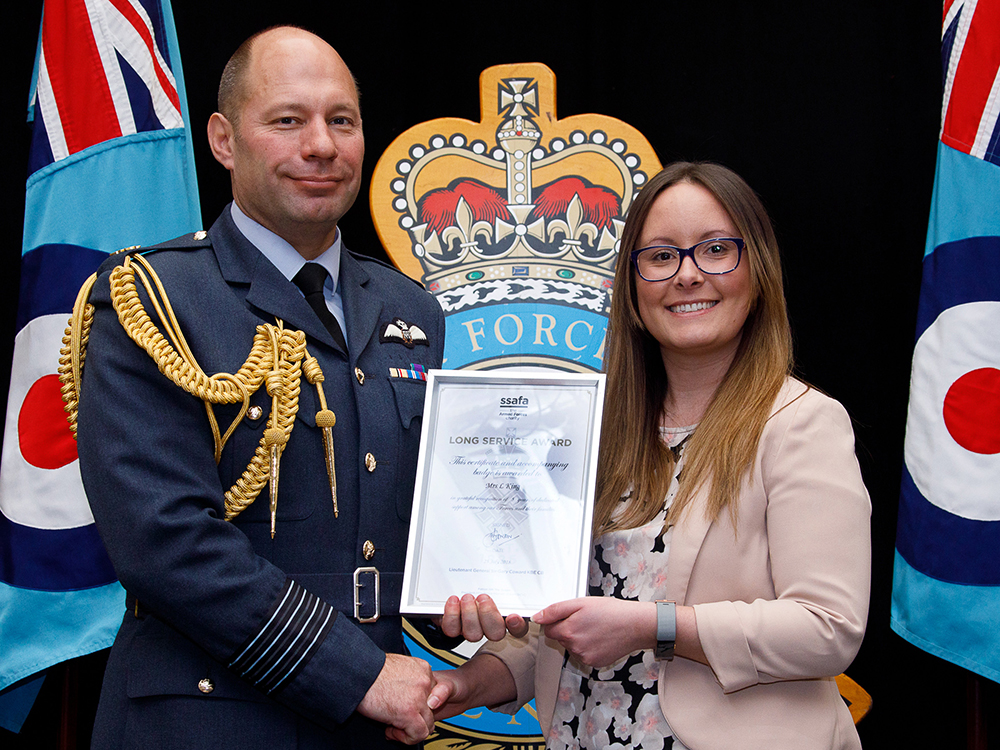 Group Captain Dan James awarding Mrs Leanne King
