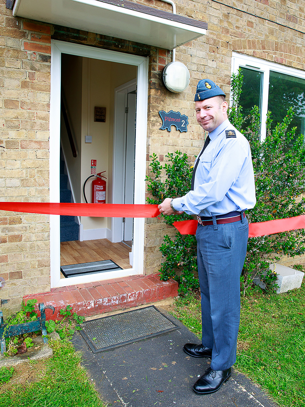 RAF Brize Norton Station Commander, Group Captain Dan James, officially re-opens the welfare houses.
