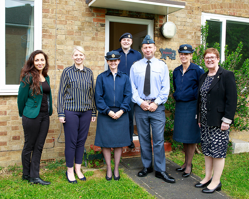 Group Captain Dan James, RAF Brize Norton Station Commander, with members of the Community Support Team and RAFA Representatives in front of the newly decorated welfare house.