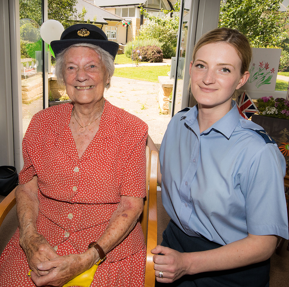 Senior Aircraftwoman Bethan Brown lets Mrs Joyce Tyrrell have a go with her RAF hat. All agreed it suited her! Joyce's brother was a Halifax bomber pilot during the Second World War and was awarded a Distinguished Flying Cross