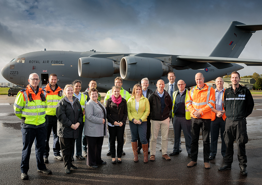 Members of No. 4624 Squadron and their Employers outside a C-17 Globemaster III aircraft.