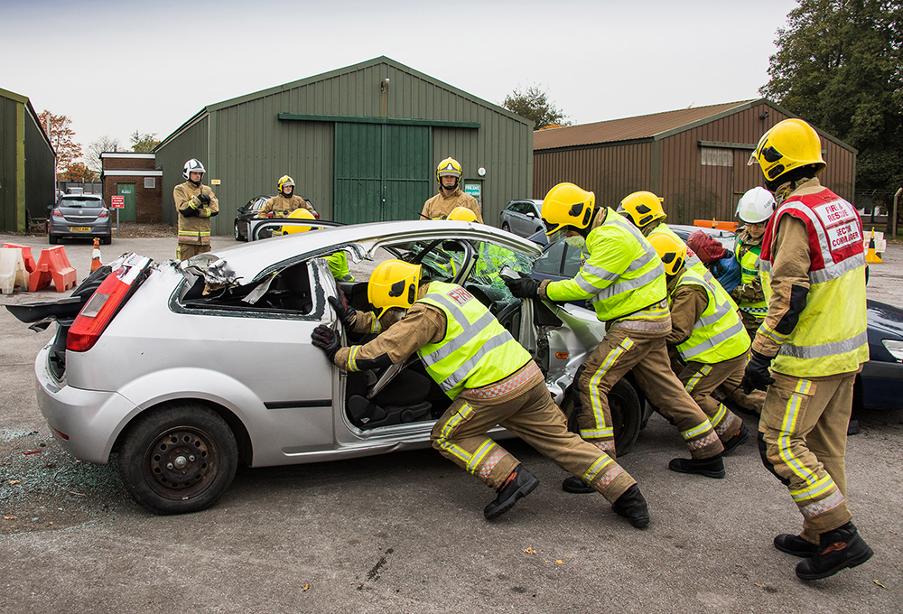 Firefighters and Medics work together during a road traffic collision 