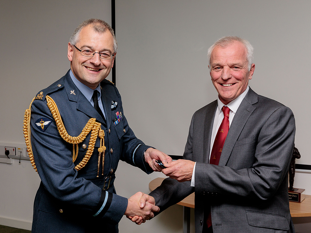 Air Commodore David McLoughlin, Air Officer Medical Operations (AO Med Ops) presents Professor Willett his Air Commodore rank slides