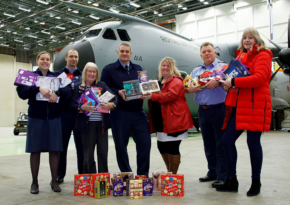 Station Charites Committee Chairman, Squadron Leader Mark Taylor (centre left), with members and Homeless Oxfordshire representatives