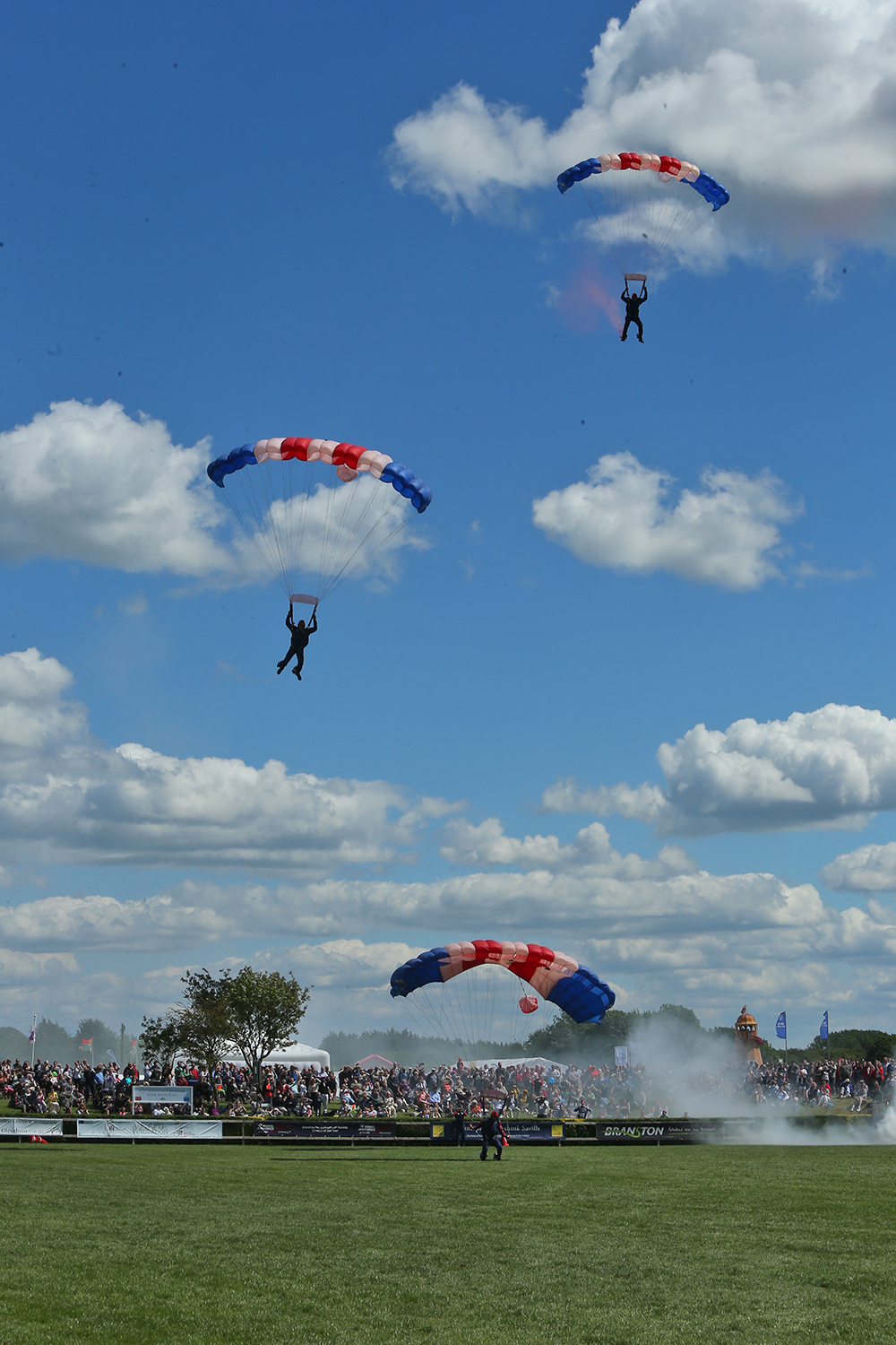 The Parachutists land with thousands gathered around the main ring