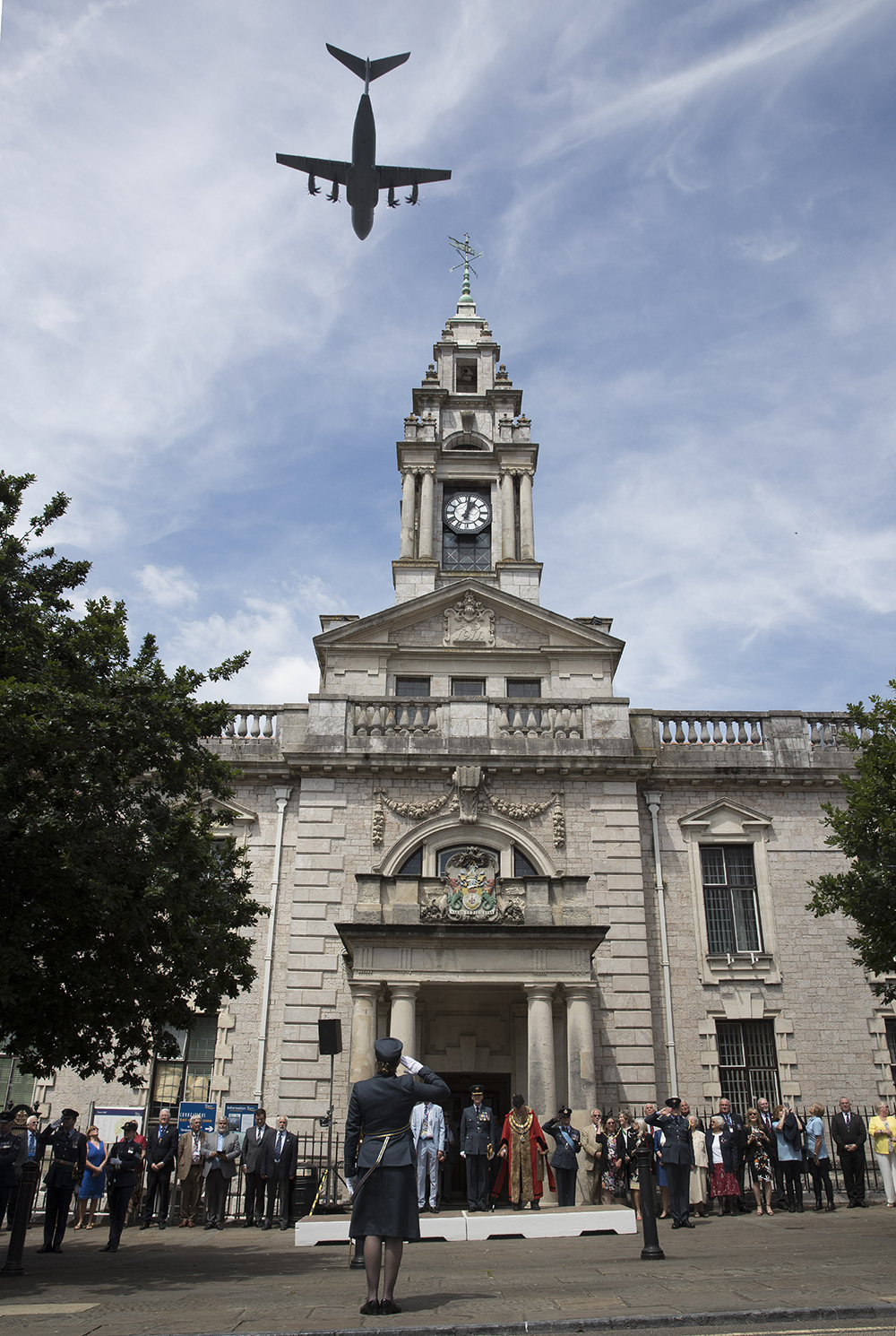 An A400M Atlas conducts a flypast over the Town Hall in Torquay.