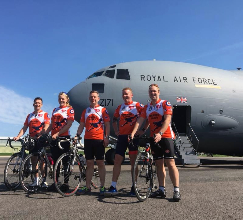 Team members stand in front of a C-17A Globemaster III of Number 99 Squadron