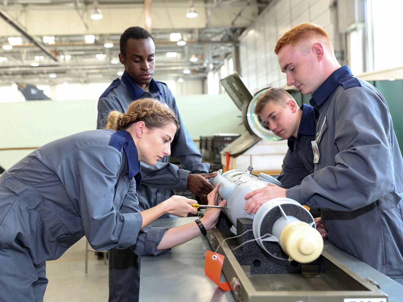 Apprentice Weapons Technicians working on Paveway Bombs