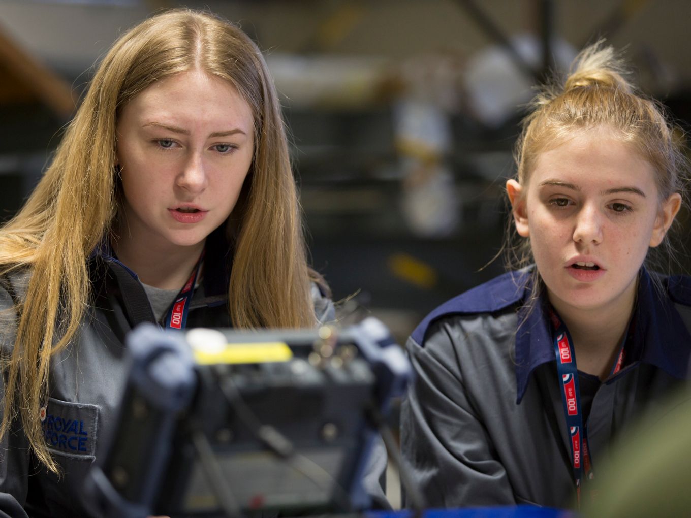 Two students from the RAF100 STEM weekend using ultrasound non-destructive testing equipment. 