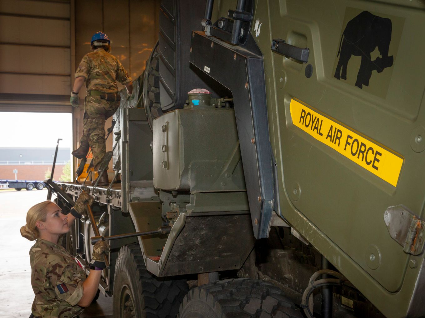 Personnel from No 2 Mechanical Transport Squadron working on vehicles similar to those deployed to Exercise Said Sareea.