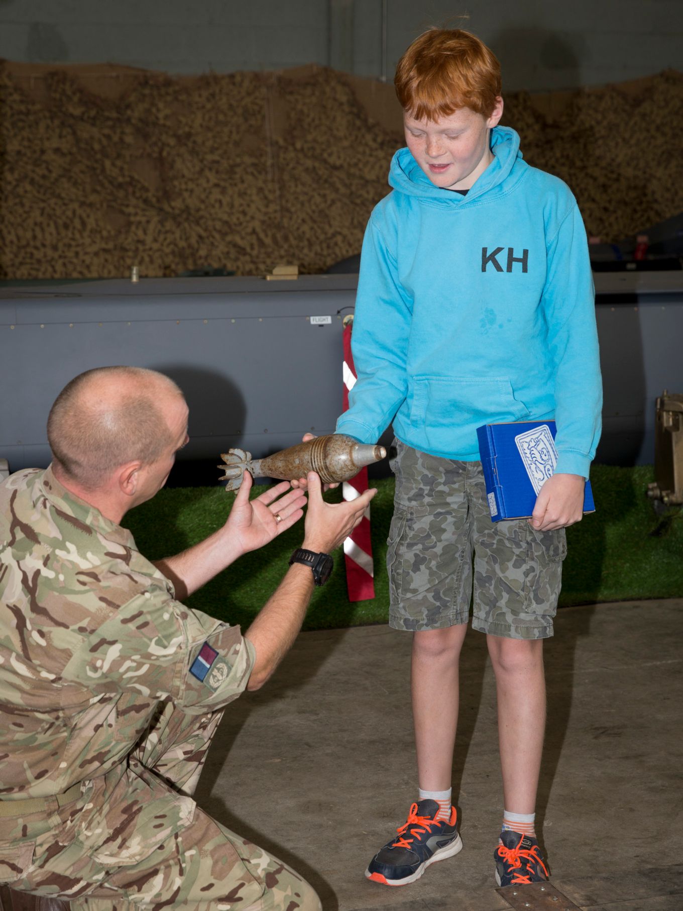 Sgt Tim Latchford shows Monty an example of the mortar he pulled from the River Cam