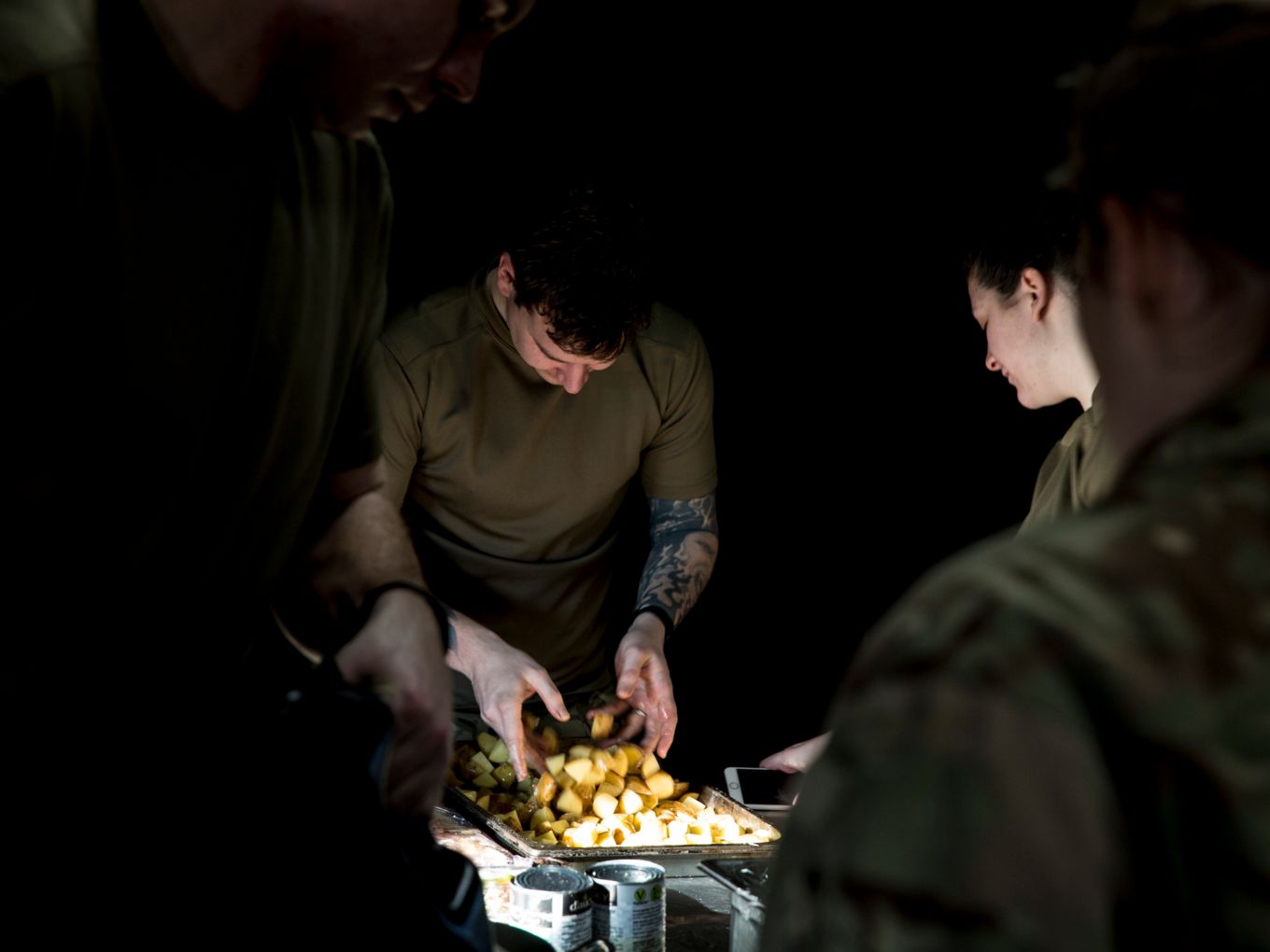 The trainees prepare roast potatoes