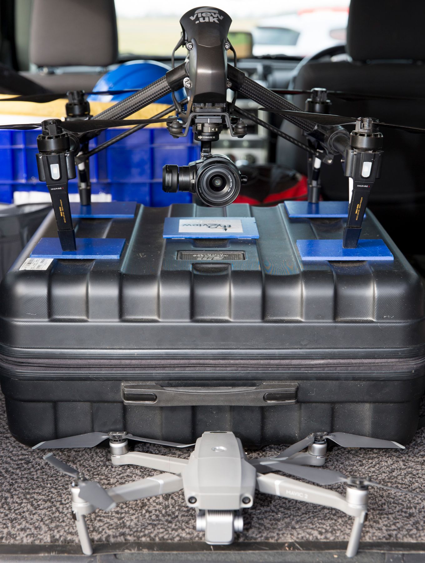 Safely in the back of the vehicle, two of the drones used by Fly2View