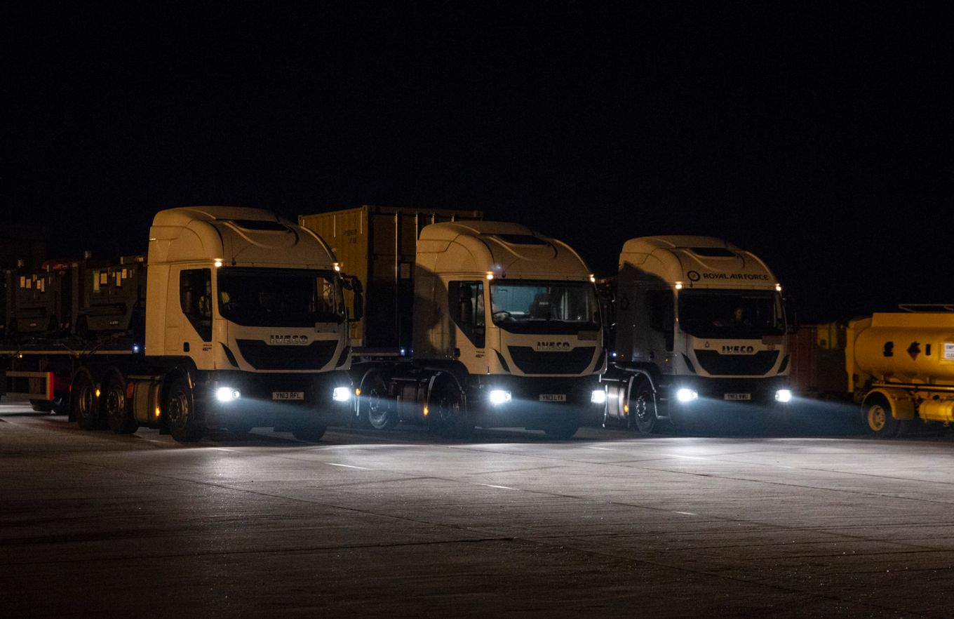 The trucks drive off 