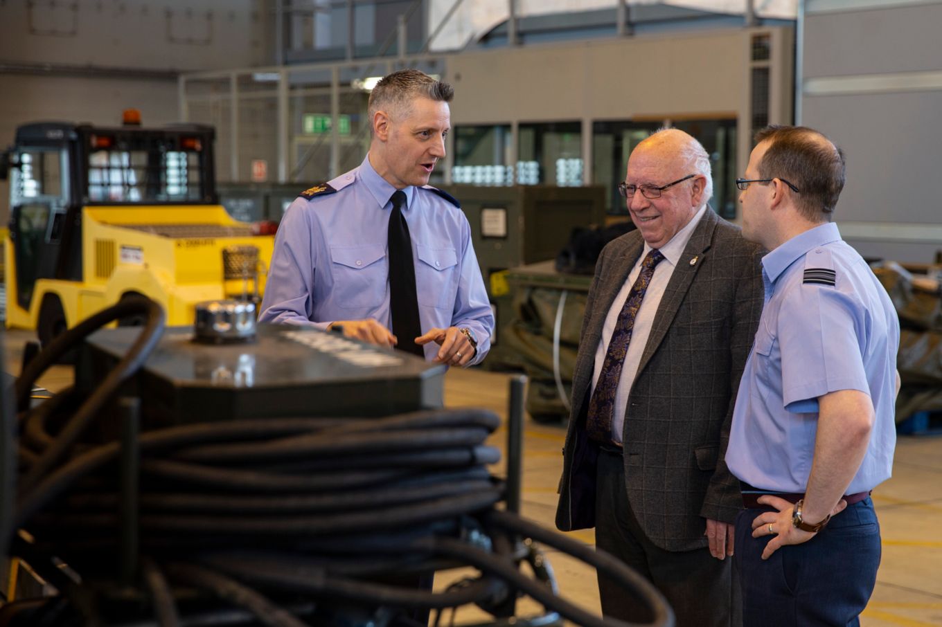 Warrant Officer Thomas and Squadron Leader Davies show Mr Chesher-Brazier the equipment used by 5001 Squadron today