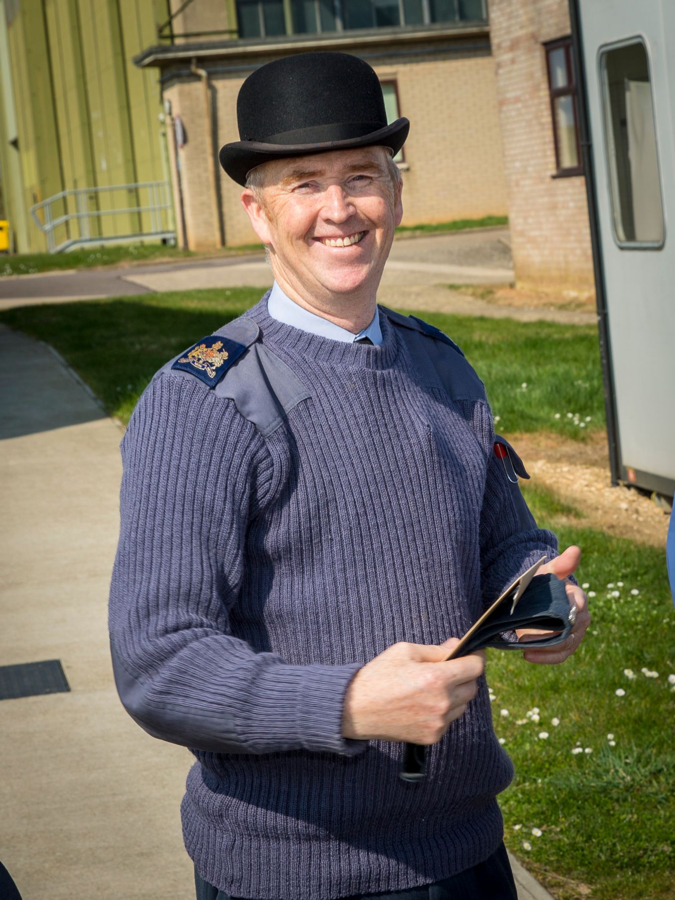 Mr Davies in the traditional bowler hat worn by retiring RAF Warrant Officers