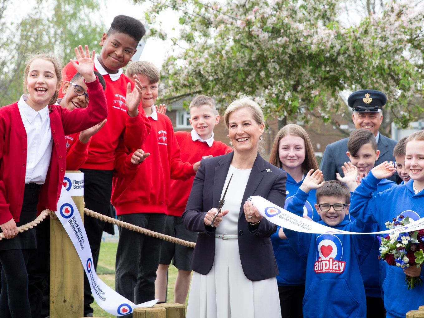 HRH cuts the ribbon and declares the playpark open
