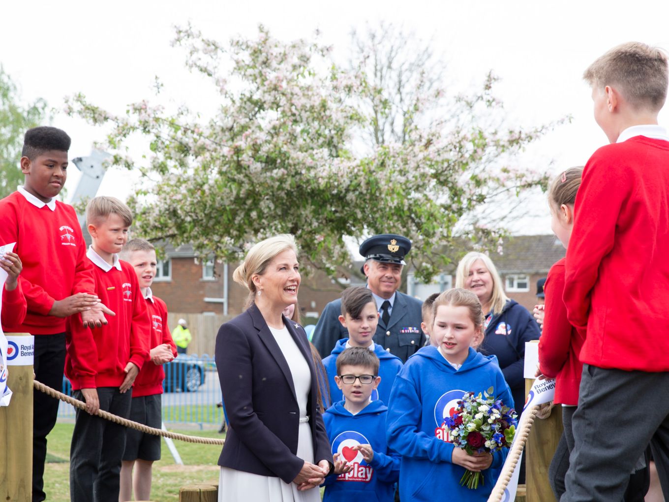 HRH meets some of the children, Hannah Avery is holding the posy.
