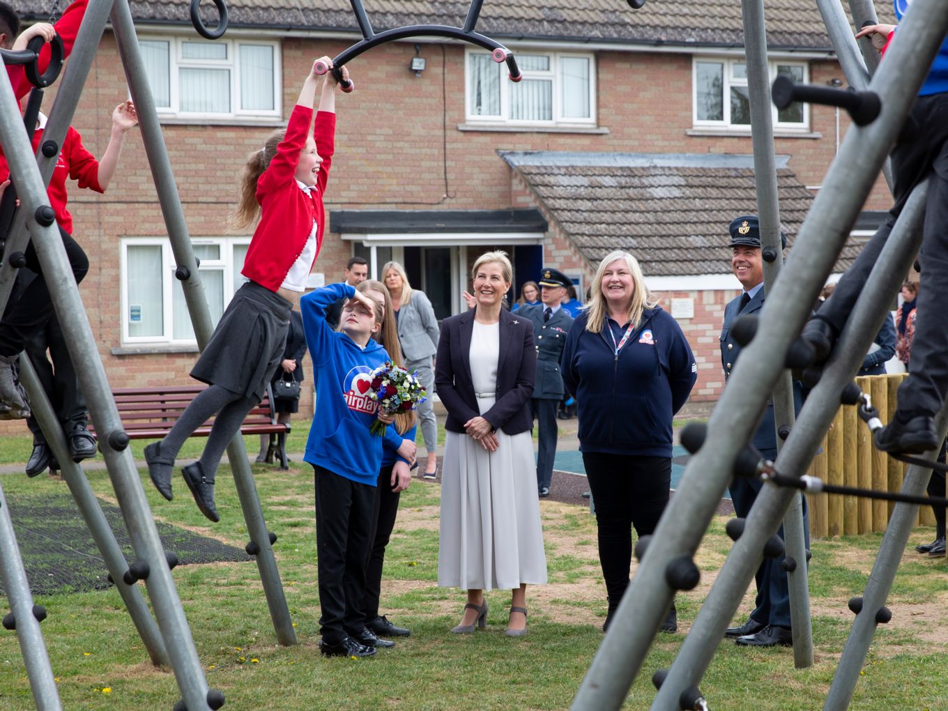 One of the children from Wittering Primary School tests out the new monkey bars