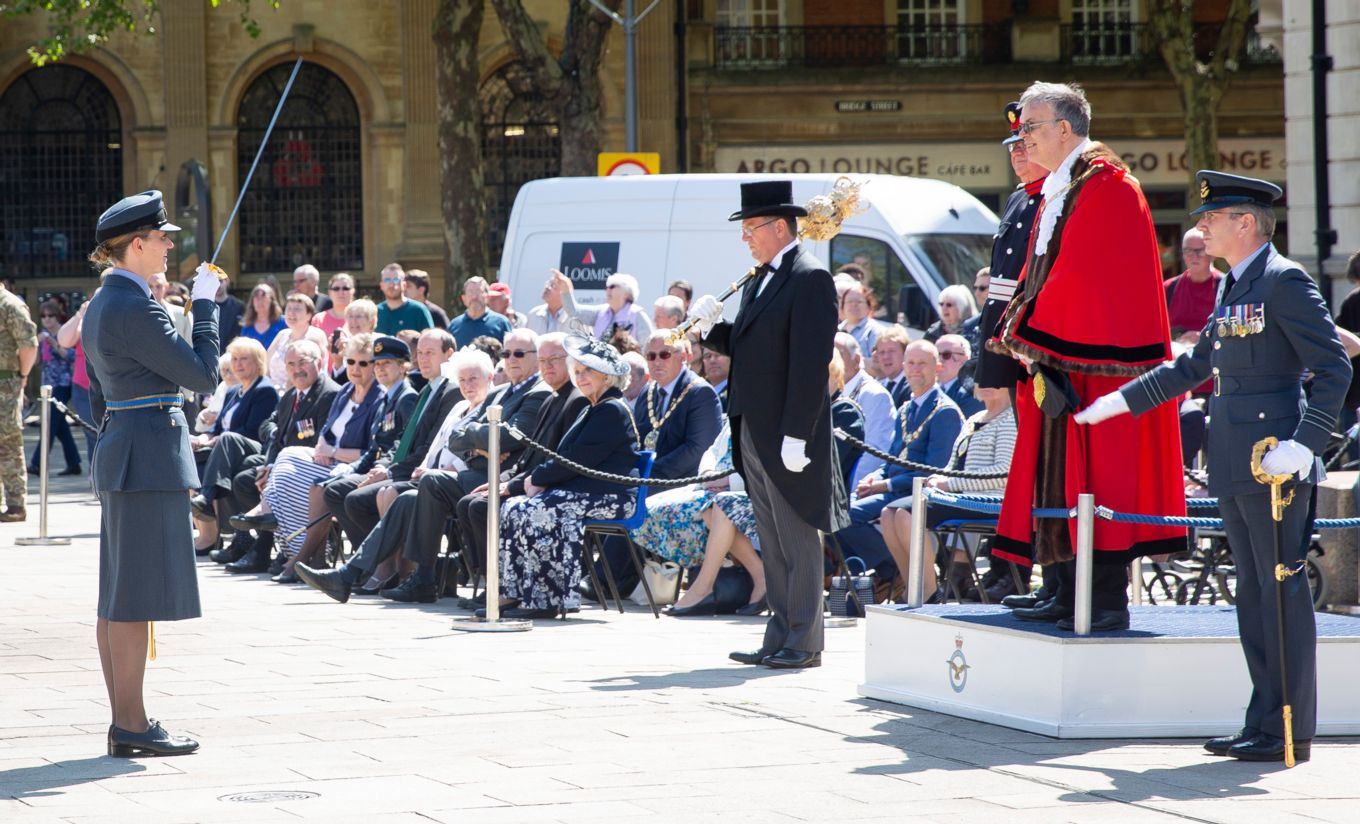 Sqn Ldr Wolstenholme salutes the Mayor of Peterborough