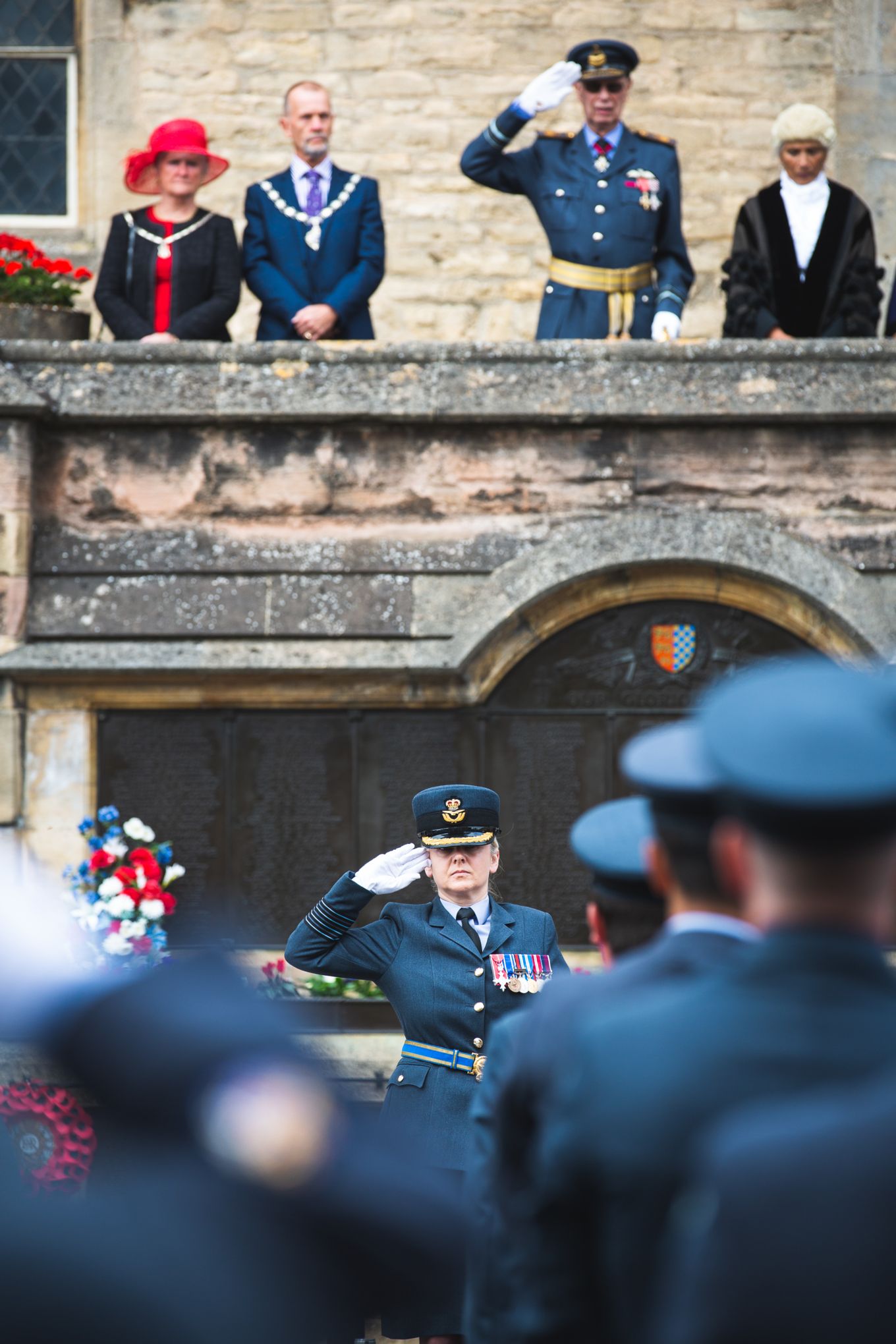 Group Captain Lincoln salutes the parade