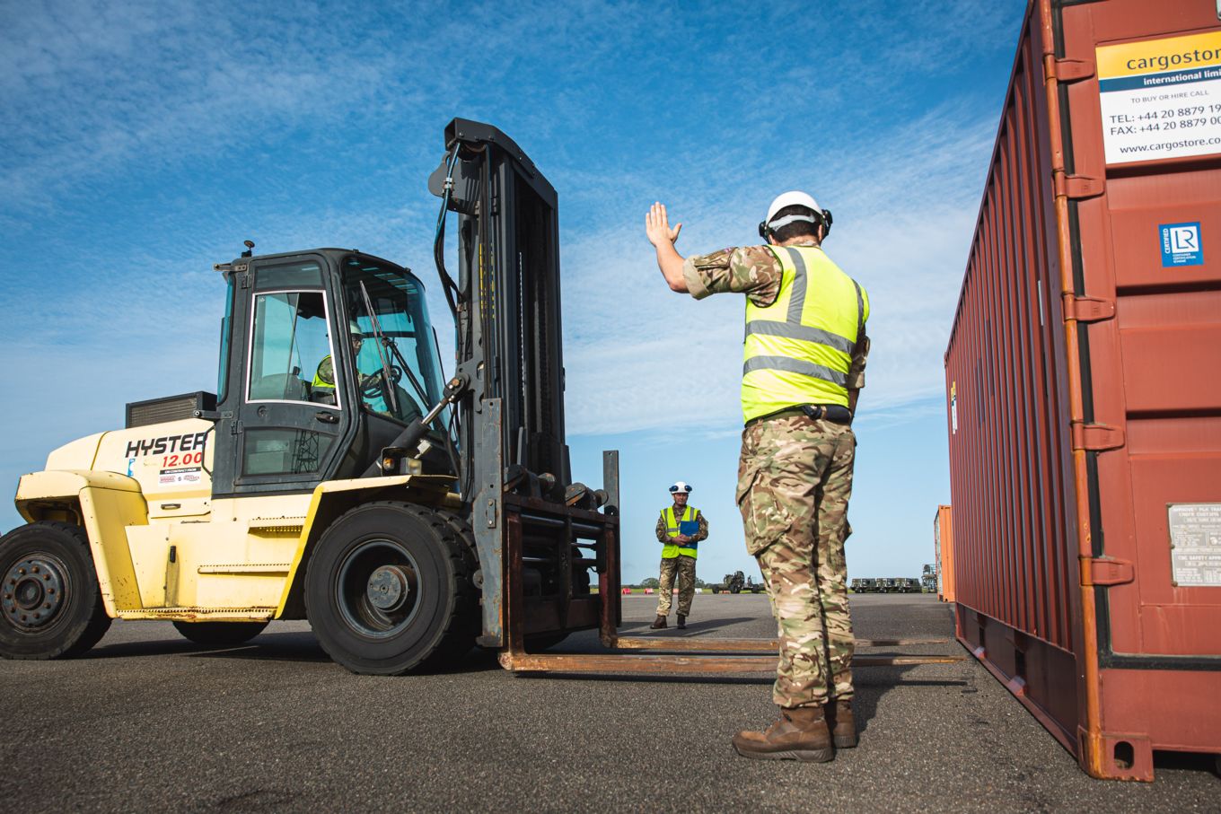 Port Liaison Team preparing cargo for transport.