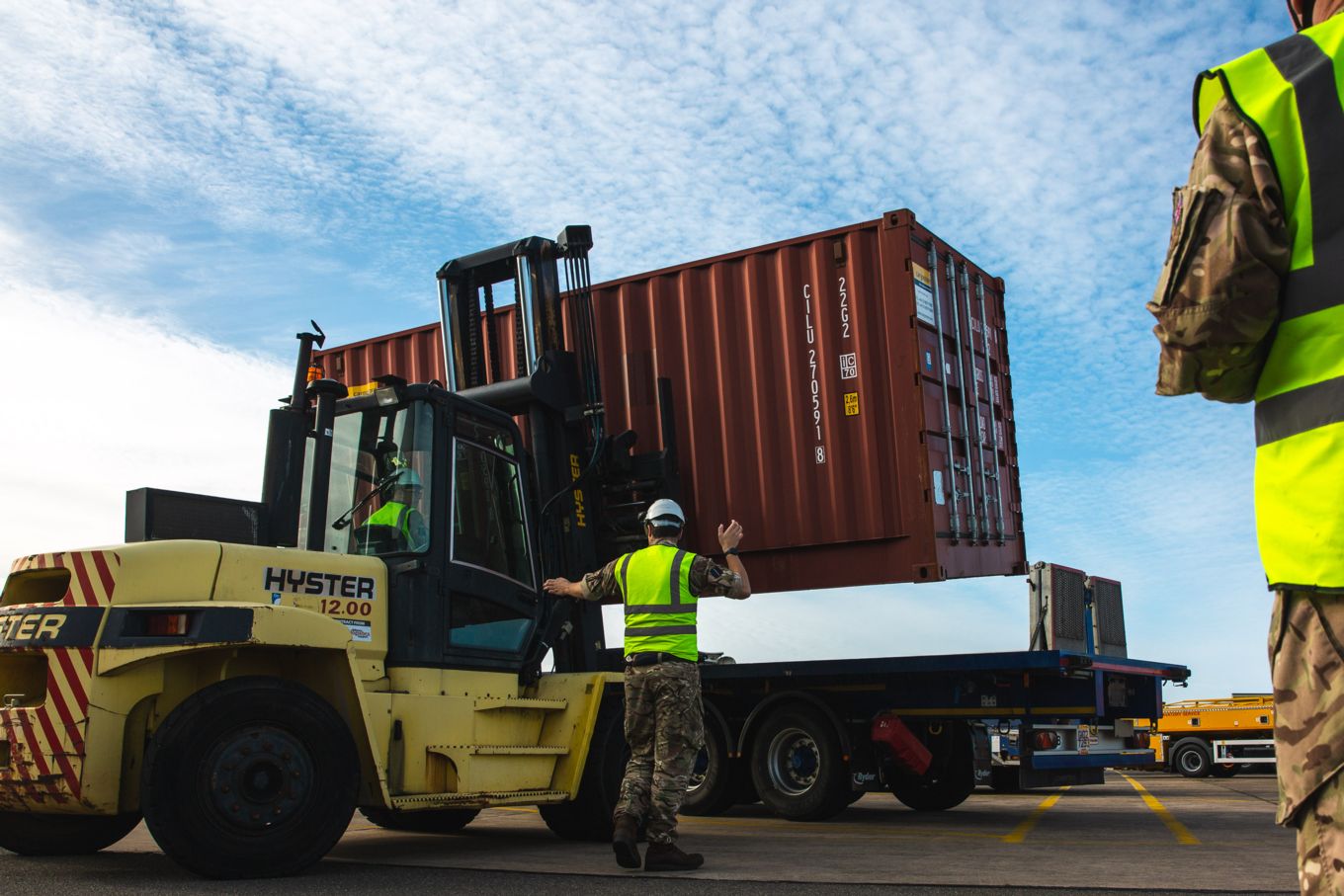 Port Liaison Team preparing cargo for transport.