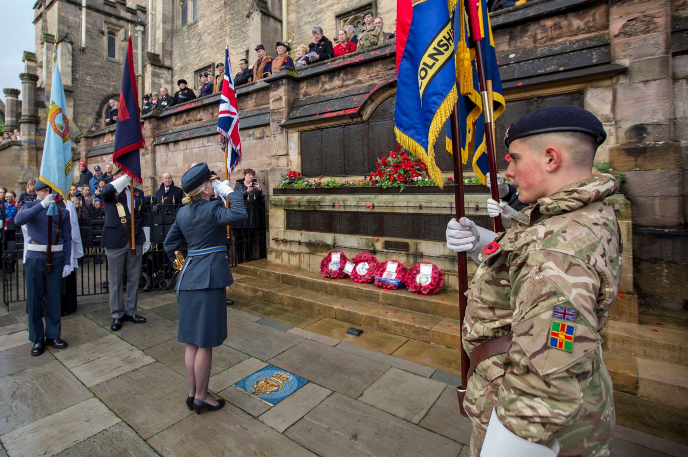 Group Captain Jo Lincoln salutes The Fallen at the memorial outside Browne’s Hospital in Stamford.