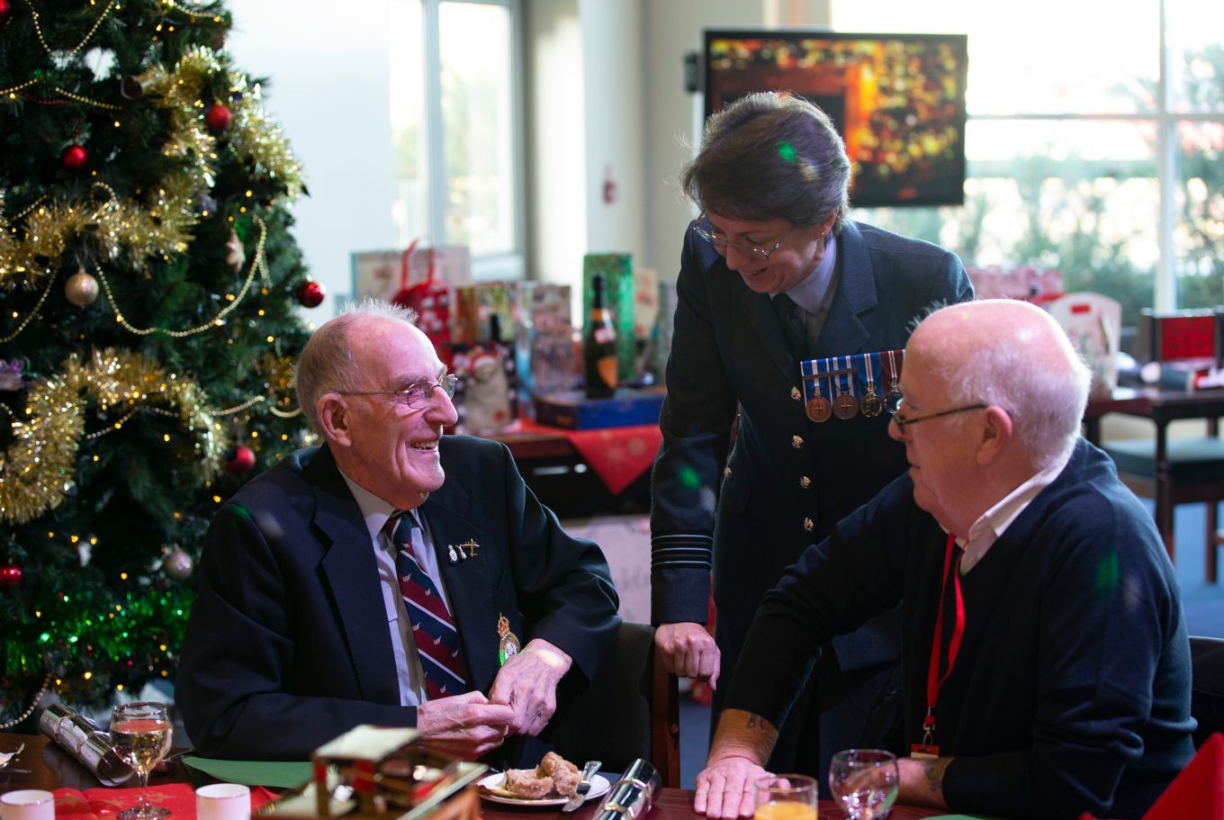 Wing Commander Maggie Boyle with two of the guests.