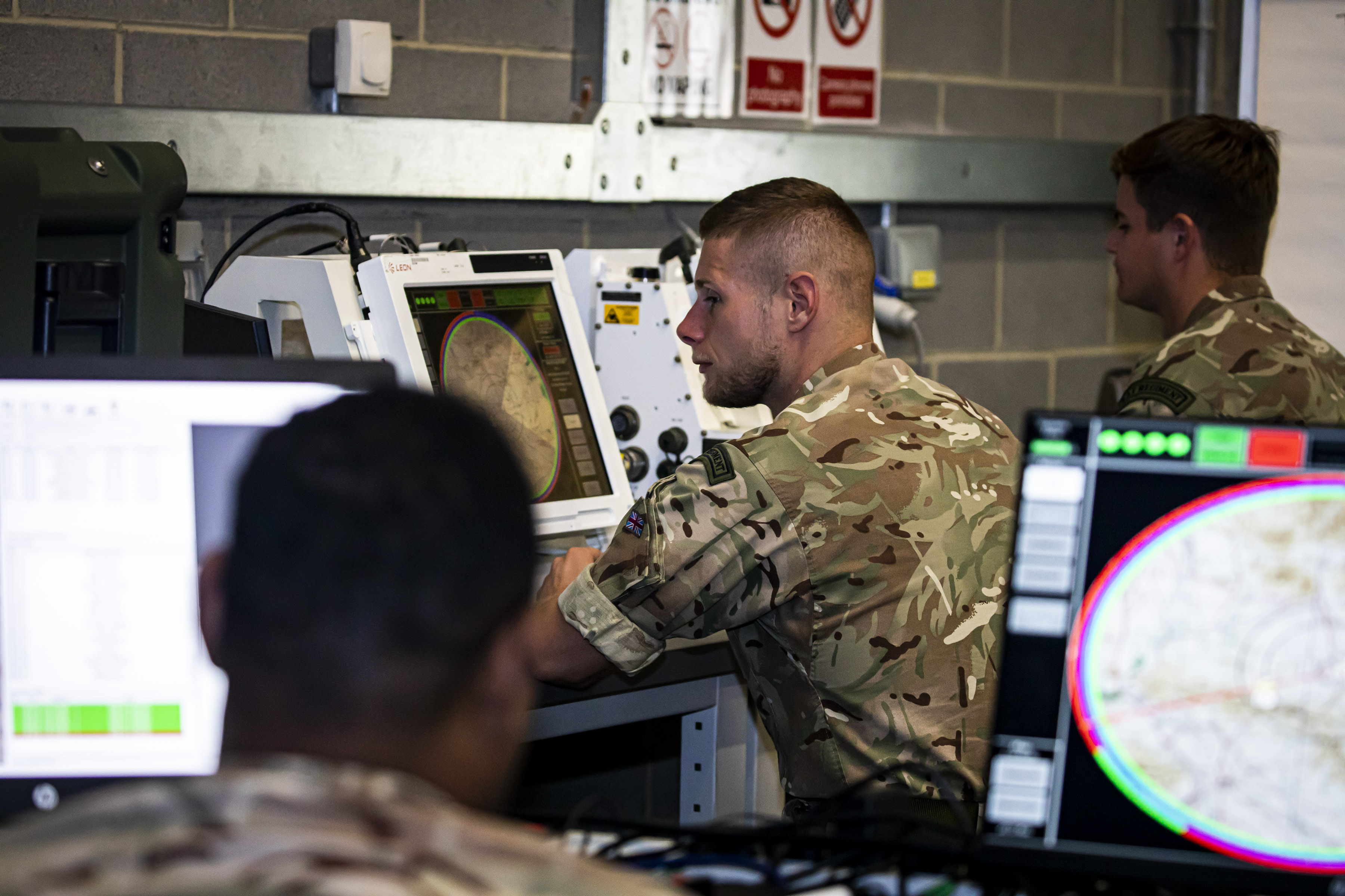 RAF Regiment personnel sat at screens, operating counter-uncrewed aerial systems equipment.