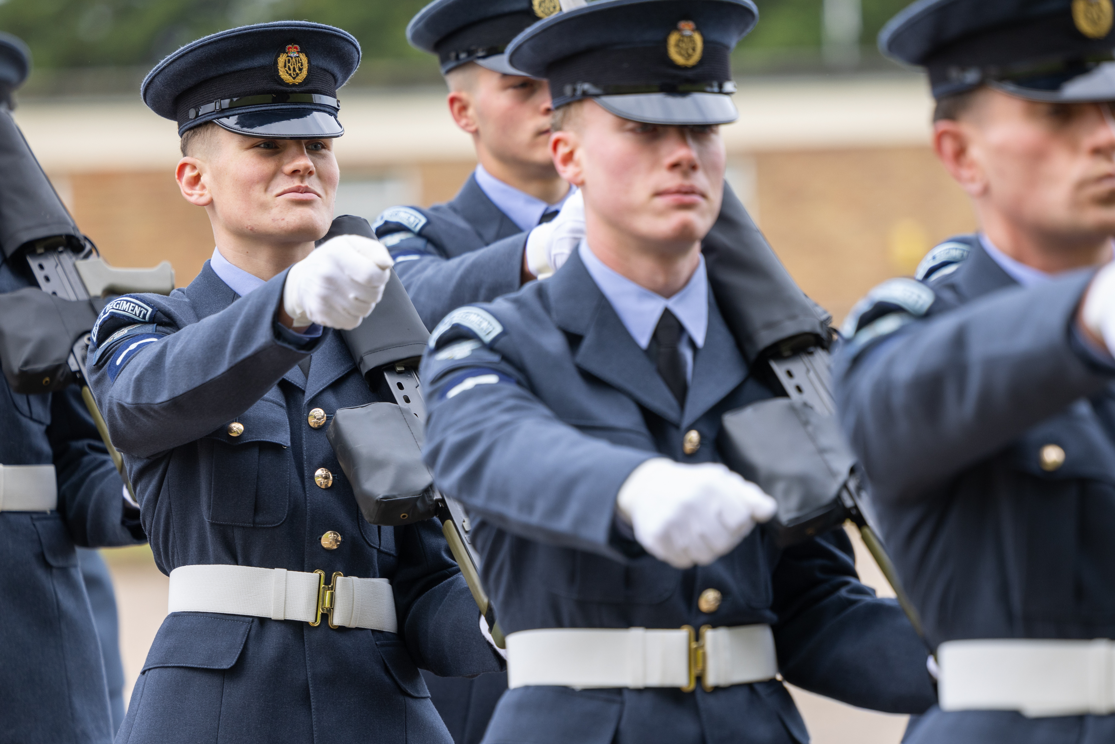 Personnel marching in line during a parade. 