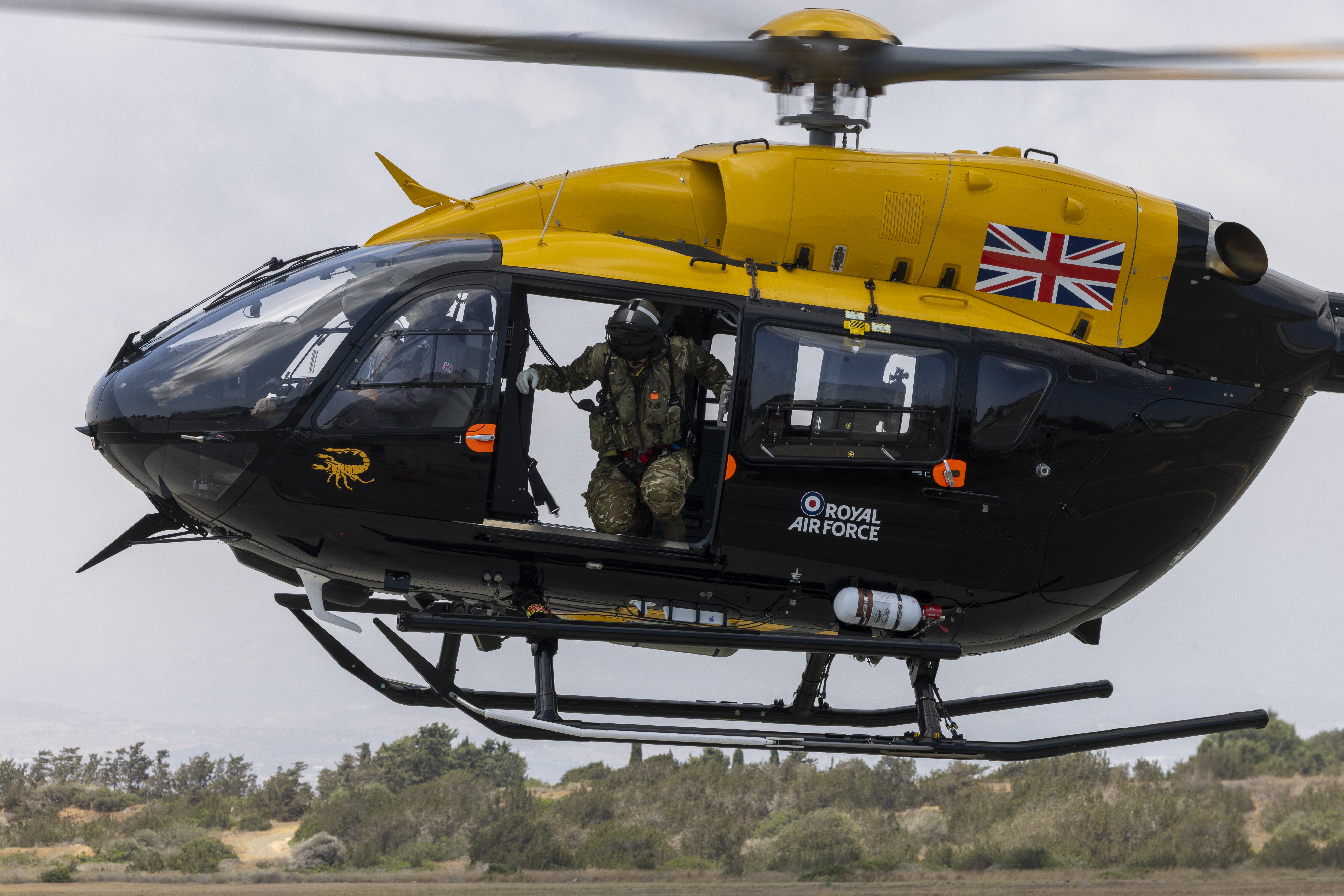 An RAF H145 Jupiter helicopter hovers over the pan at RAF Akrotiri