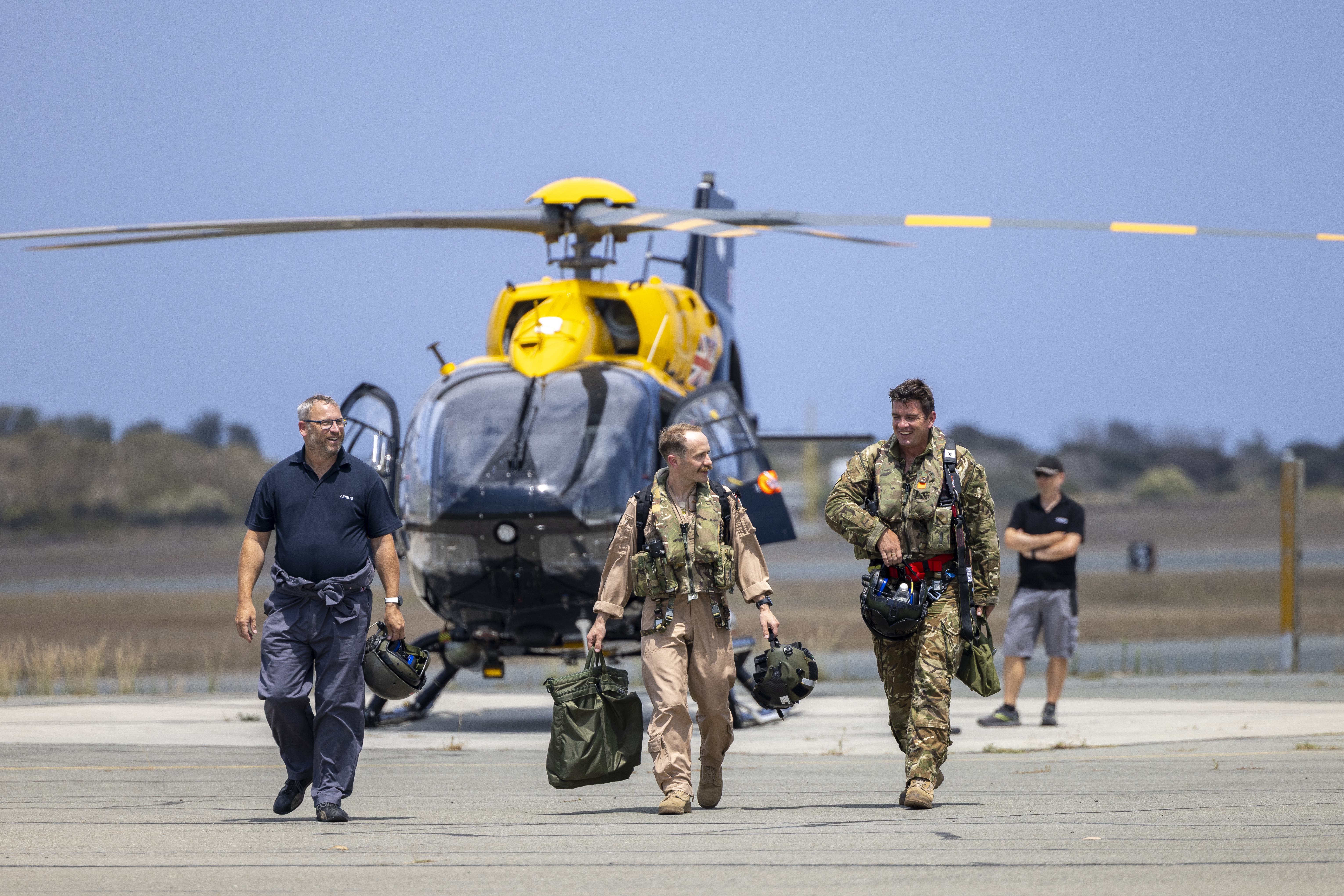Crew walk away from the h145 Jupiter helicopter after its first flight at RAF Akrotiri