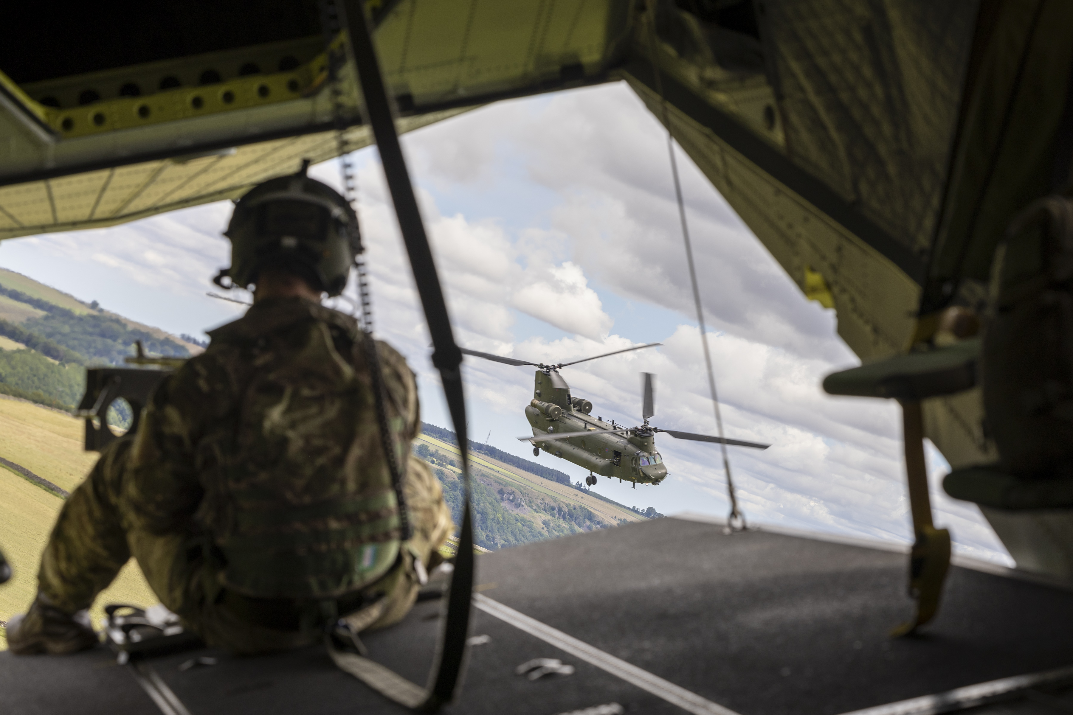 A service person on the back of a Chinook