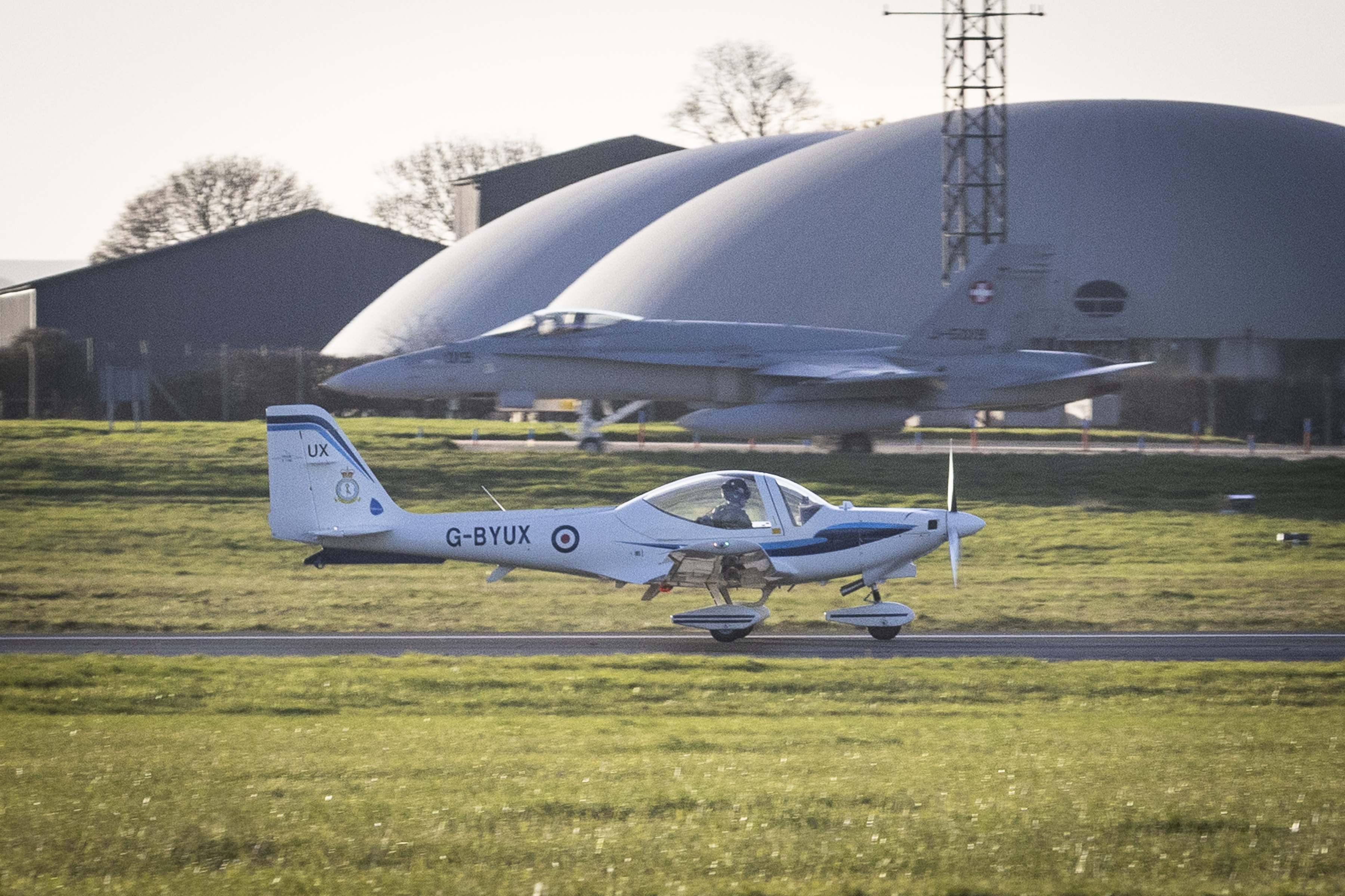Tutor aircraft with Swiss F18 jet in the background