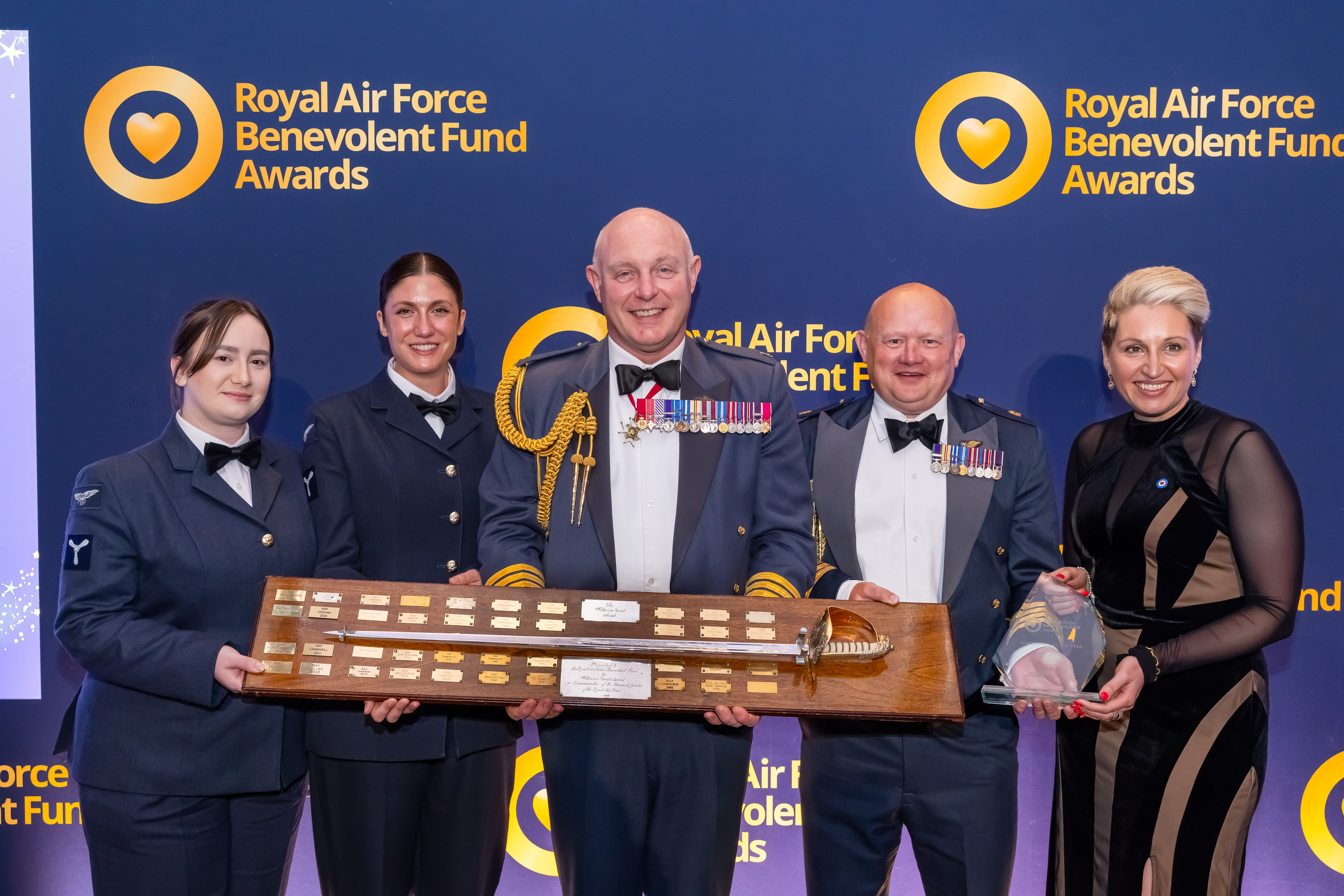 Group of military personnel receive RAF Ben Fund Award