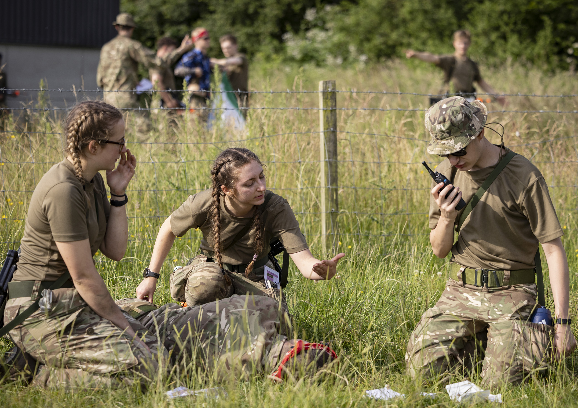 Three students from Yorkshire University Air Squadron in conversation during LeadEx