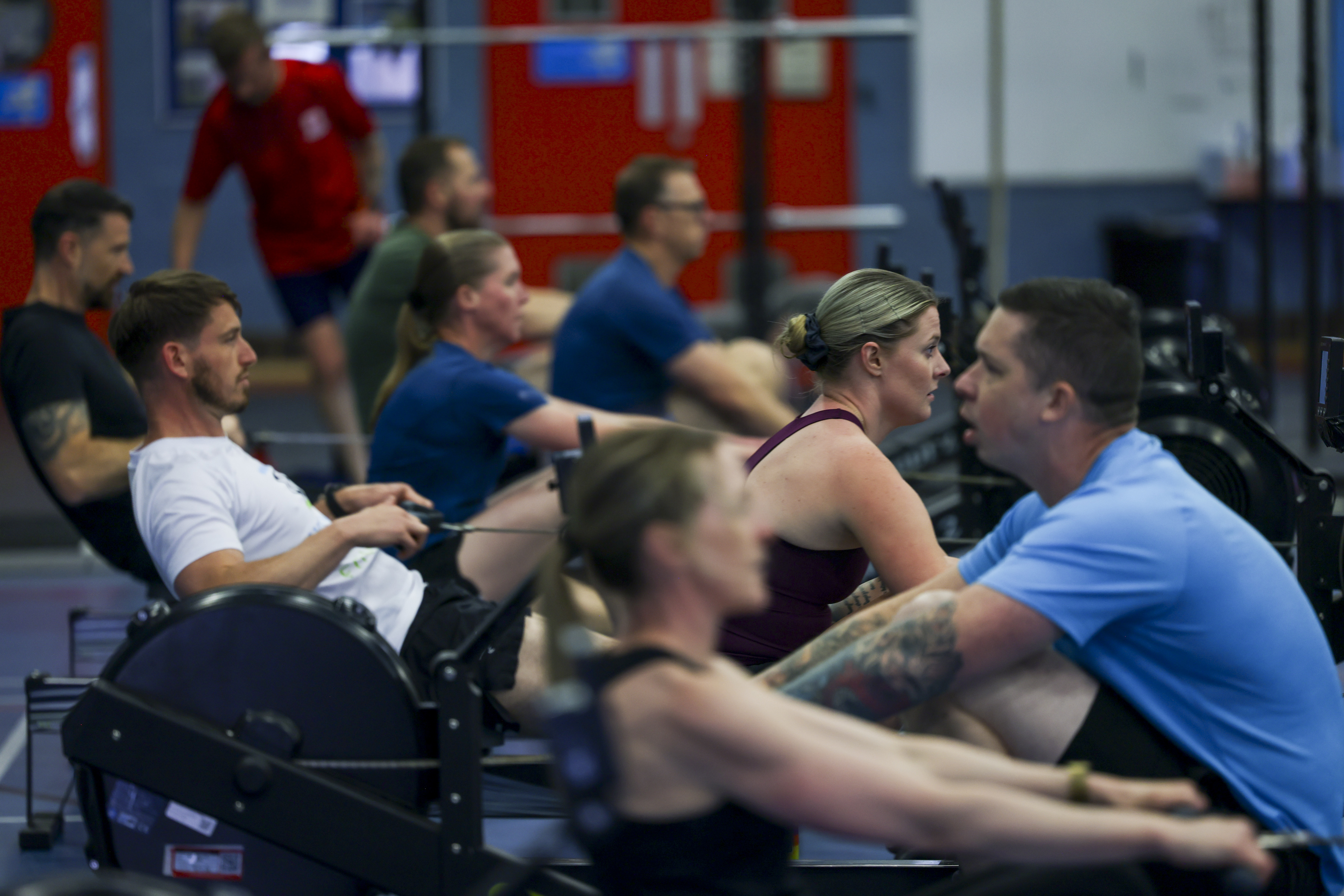 People exercising on rowing machines