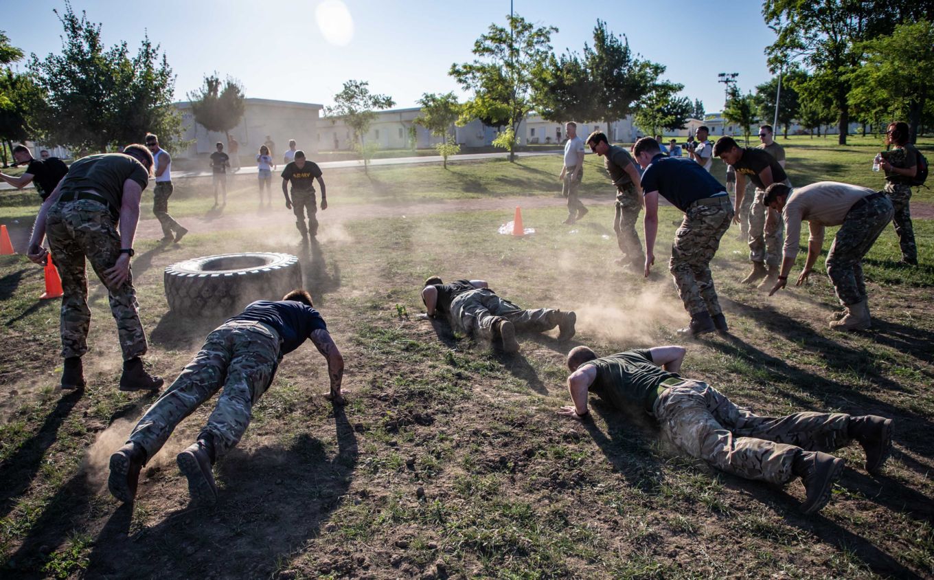 Personnel perform exercises. 