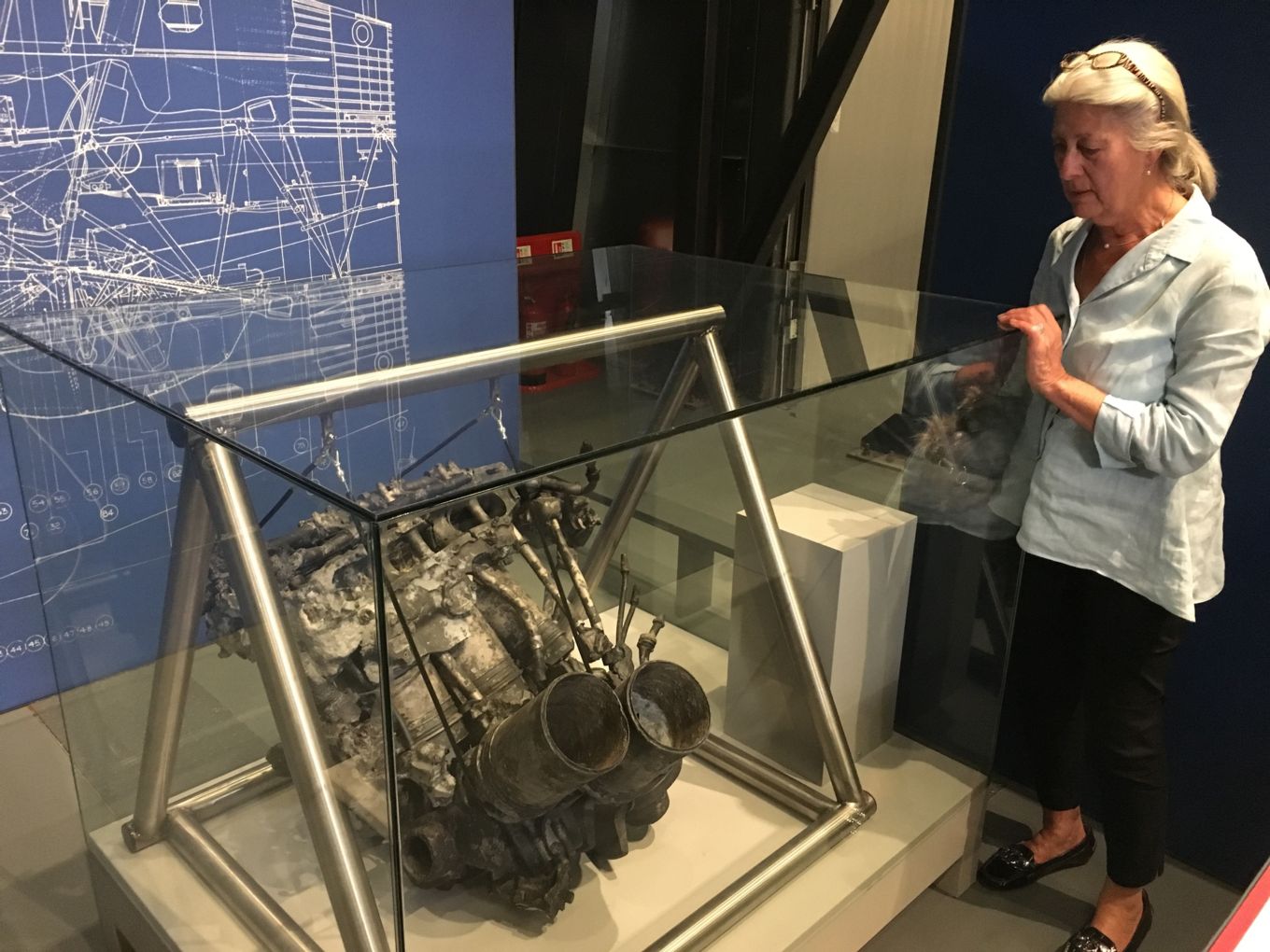 Anne Holmes with the engine of her late husband’s Hurricane.