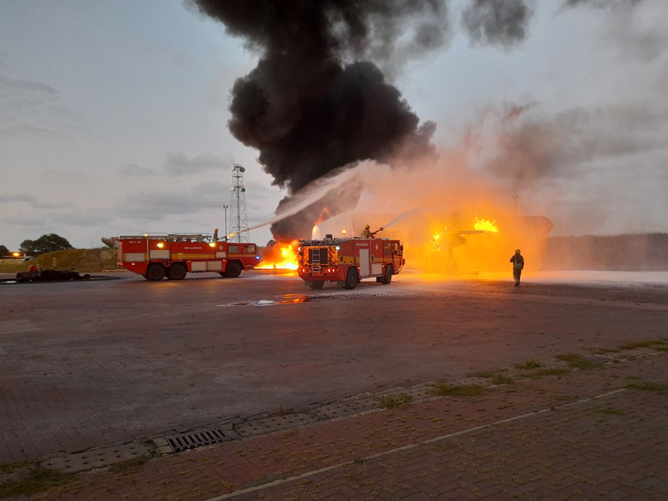Two Fire Engines put out a practise fire.