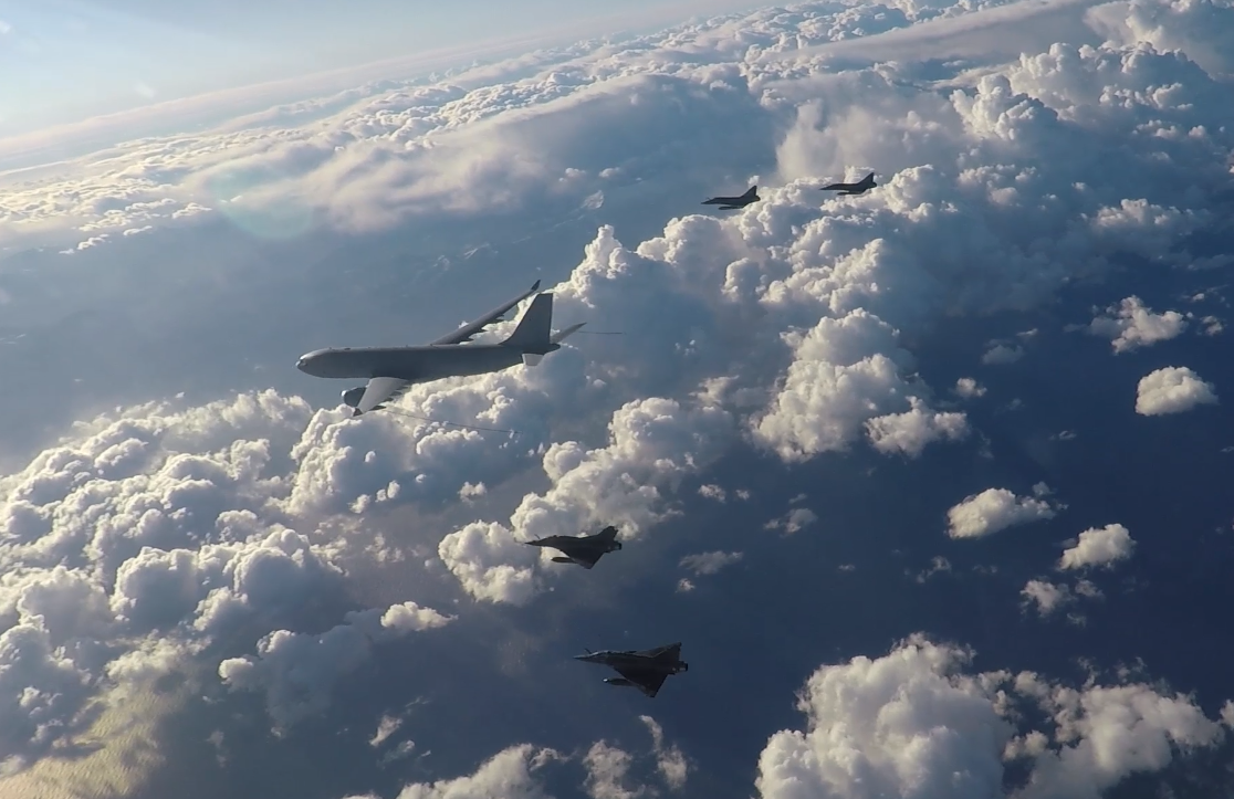 Image shows an RAF Voyager aircraft flying alongside four French Mirage 2000 aircraft.
