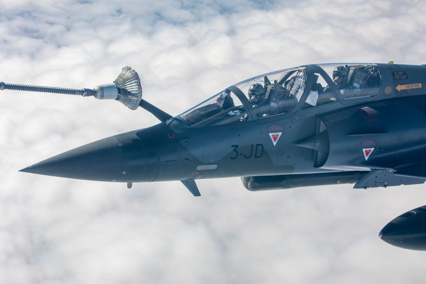 Image shows a French Mirage 2000 aircraft while conducting air-to-air refuelling.
