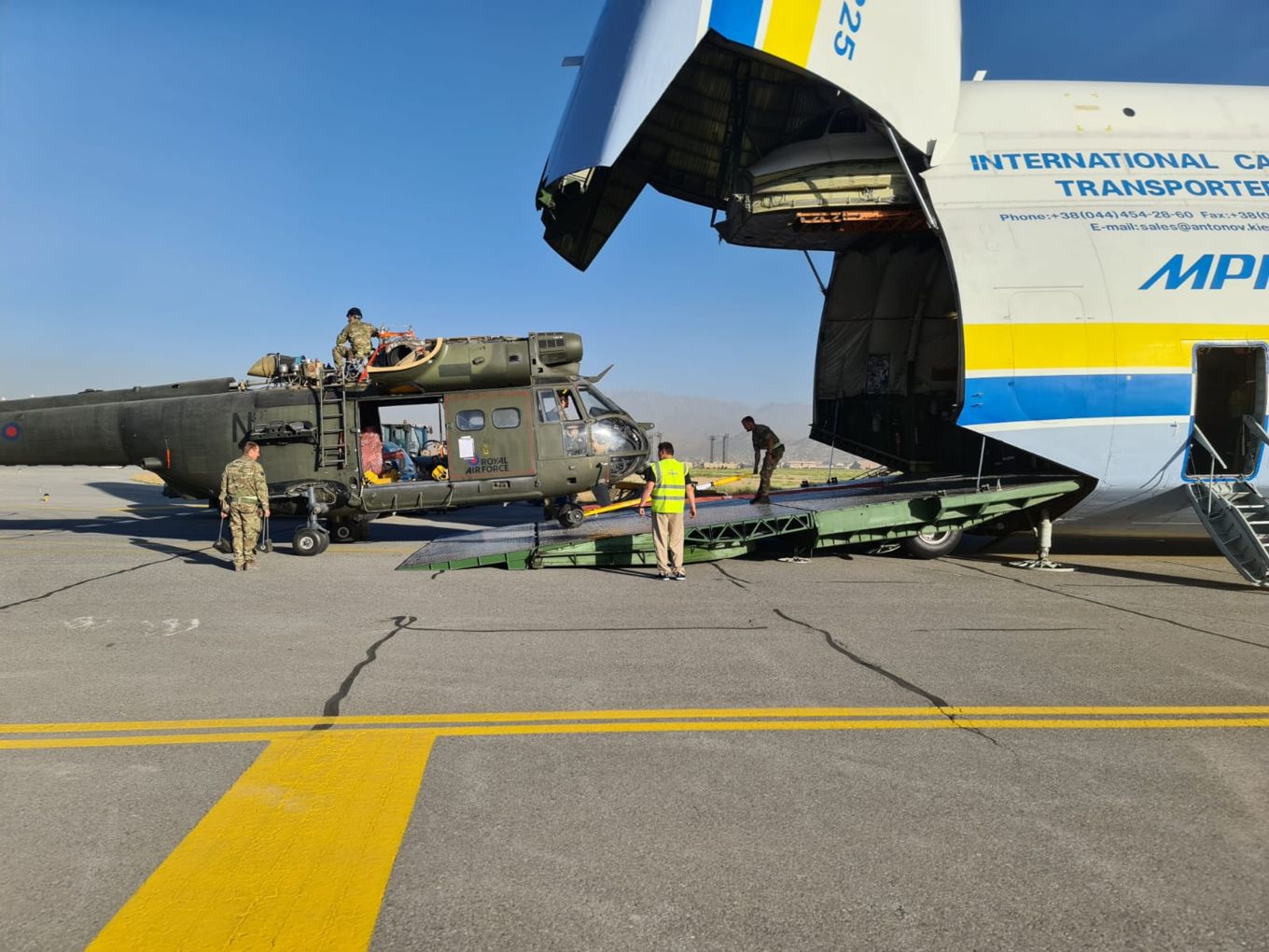 Image shows RAF Puma helicopter being loaded into an Antonov AN-225 aircraft.
