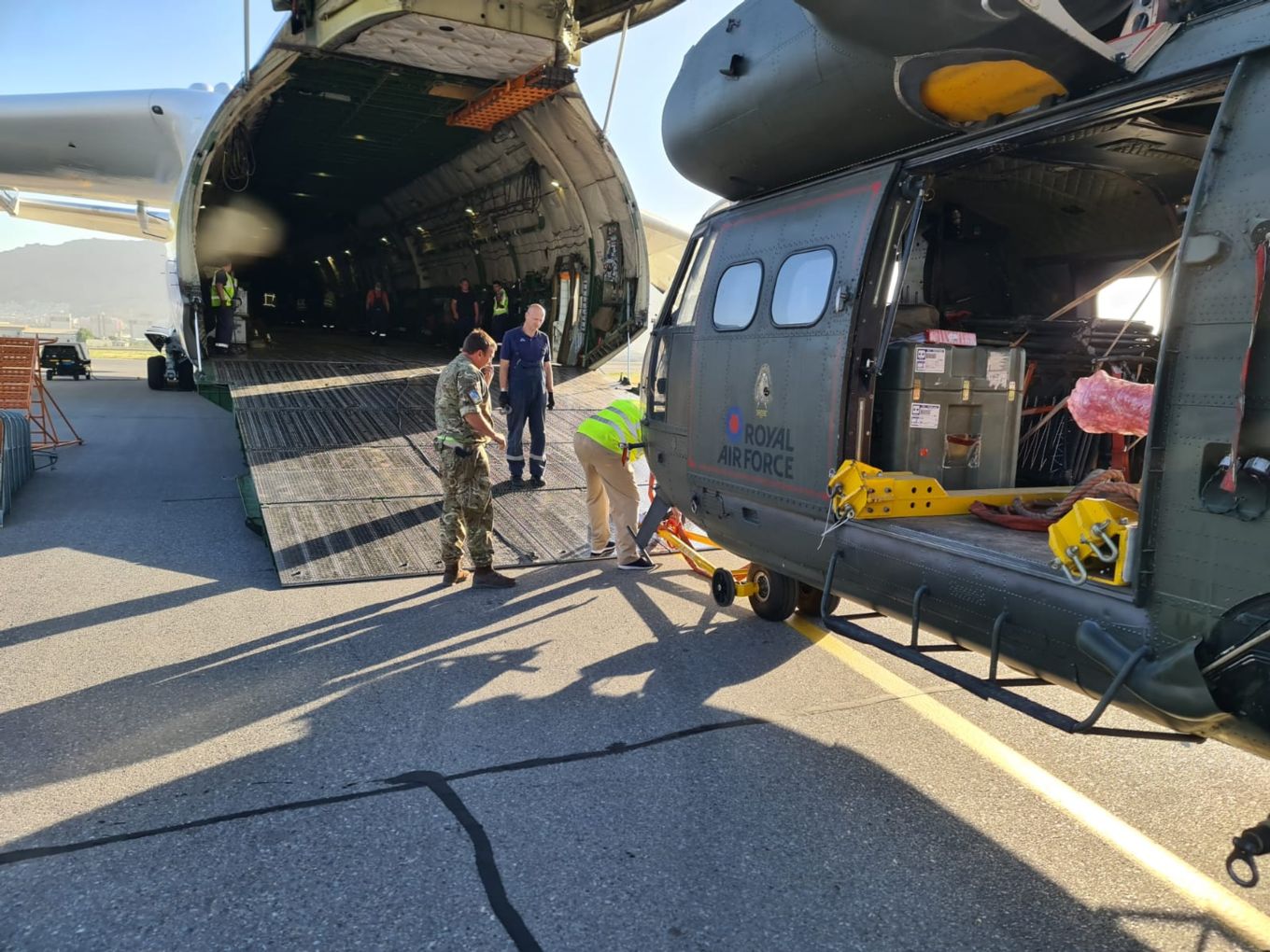Image shows RAF Puma helicopter being loaded into an Antonov AN-225 aircraft.